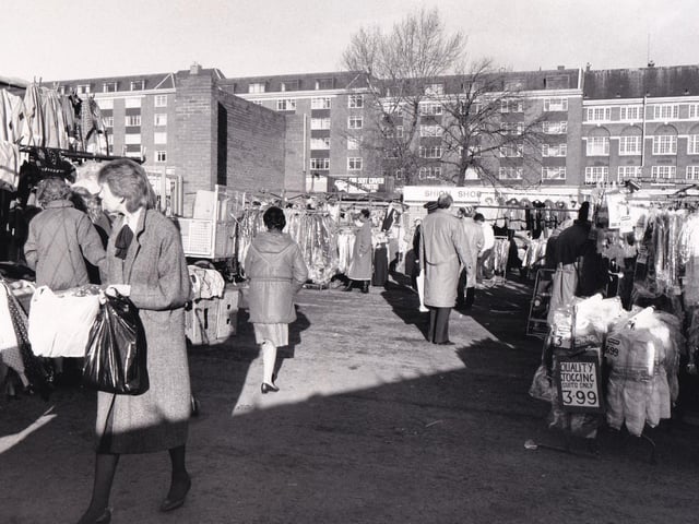 Another view of the open air market in November 1988. Have you noticed the price of quality jogging suits?