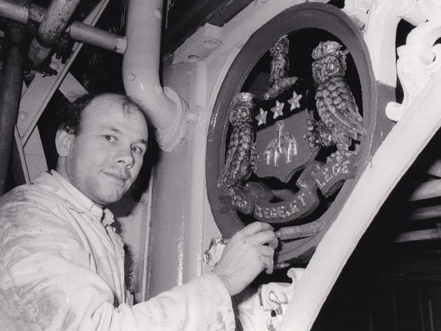 John Burton from Bramley paints part of the decorations on the roof of Kirkgate Market in April 1981.
