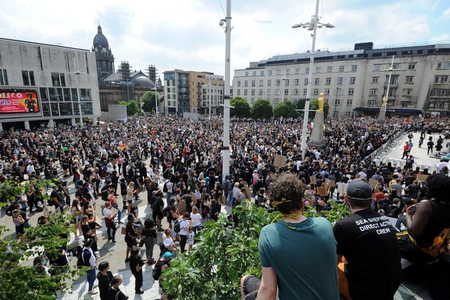 Protesters climbed the steps for a better view over Millennium Square