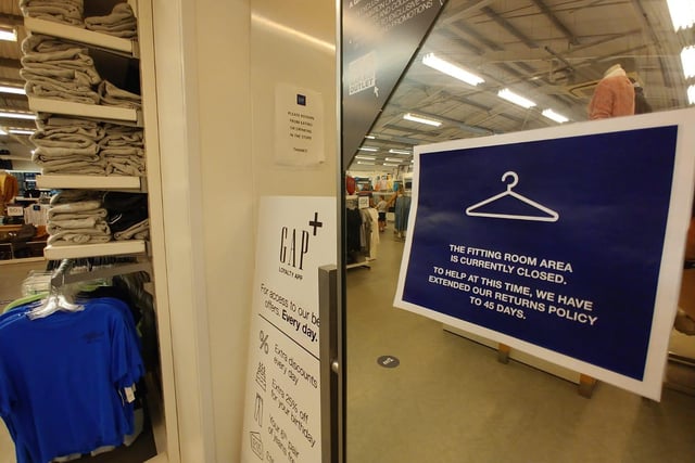 Changing rooms are closed, but the store has extended it's returns policy should you have any problems.
