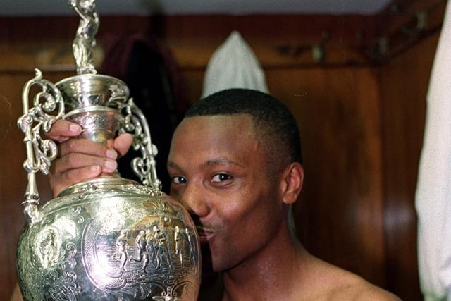 Hot Rod Wallace kisses the trophy. He scored 11 league goals for the Whites that season.