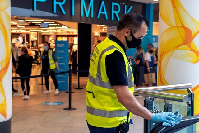 Staff clean the inside of the Trinity Centre for shoppers as disinfecting surfaces becomes a regular thing