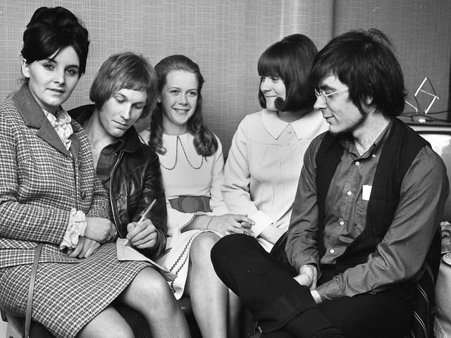 Singer Mike D'Abo and Mike Lubowitz from the group Manfred Mann, sign autographs for fans backstage at Wigan Casino where they appeared on Saturday 1st of June 1968