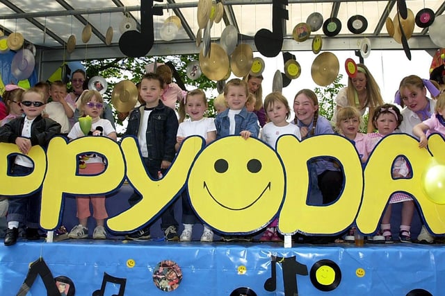 Youngsters and staff from the Happy Days Nursery on their float