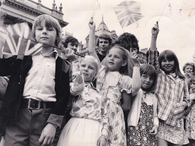 Children lining The Headrow wave their flags in June 1974. They include Simon and Sarah Finlay, and Pamela Waterman.