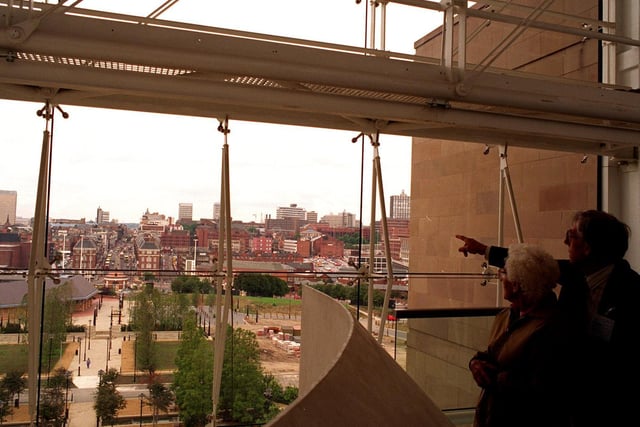 Visitors at the open day at Quarry House look out of the west window at the view over the city centre towards West Yorkshire Playhouse and Eastgate in September 1995.