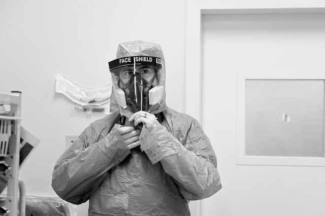 A cardiac theatre worker getting ready for surgery (Picture:  Chimane Moore)