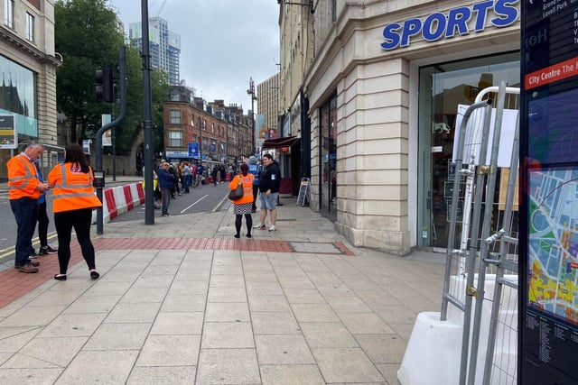 Hundreds of people queued up on Monday, June 15 around the corner to get into Sports Direct.