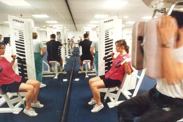 Staff members enjoy a workout in the gym after work.