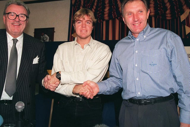 Howard Wilkinson and managing director Bill Fotherby welcome Tomas Brolin to Elland Road in Niovember 1995.