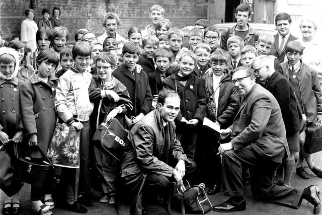 Wigan youngsters get ready to board trains to Blackpool for their wakes weeks holiday in 1969