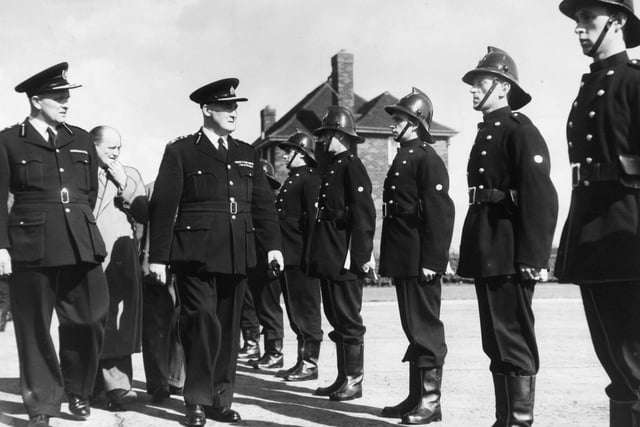 HM Inspector of Fire Brigades Mr. P. P. Booth inspecting members of the Leeds City Fire Brigade at Gipton Fire Station in September 1955.