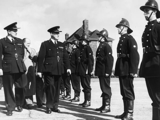 HM Inspector of Fire Brigades Mr. P. P. Booth inspecting members of the Leeds City Fire Brigade at Gipton Fire Station in September 1955.