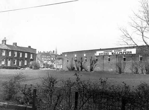 A view of Springfield Road showing part of Springhead Mill.