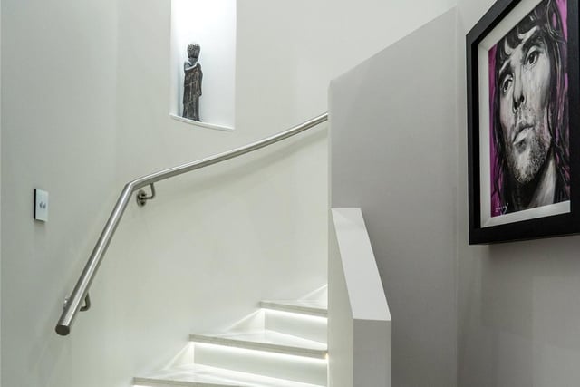 The Silestone staircase leads to the second floor.