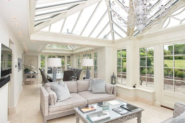 Another reception room lets in a lot of natural light due to the large windows.