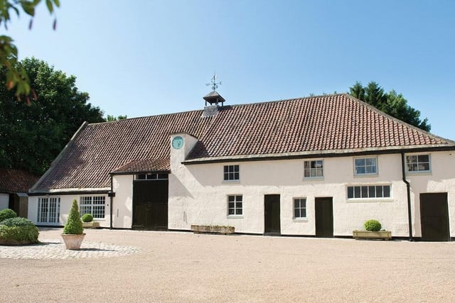 The property also has outbuildings including a Grade-II listed banquet hall.