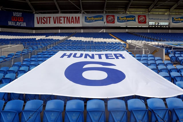 Leeds United paid tribute to club legend Norman Hunter in Cardiff following his death from coronavirus.