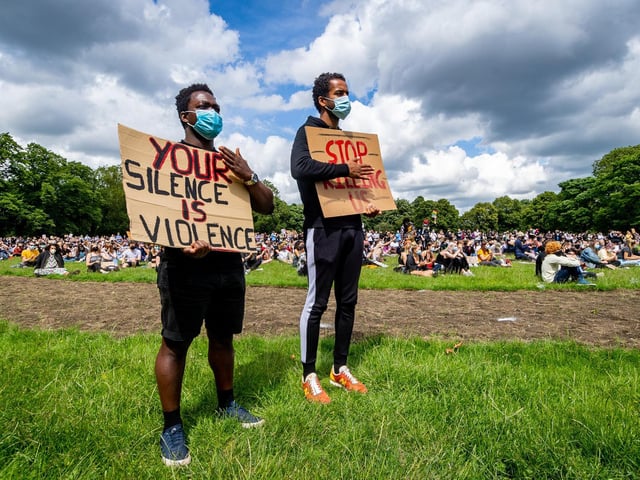 Protesters with placards at the demonstration