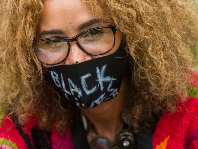 Protesters were asked to wear masks and bring sanitiser and a doctor took to the stage to remind people of the importance of social distancing
