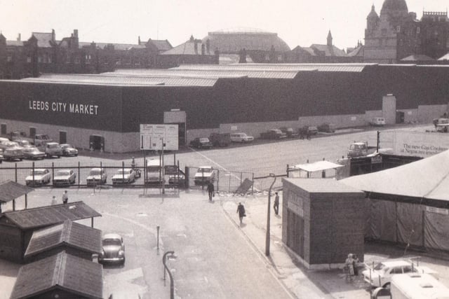 Outside the newly developed Kirkgate Market in August 1976. The 'Market Progress Report Board' can be seen in the centre of the photo.