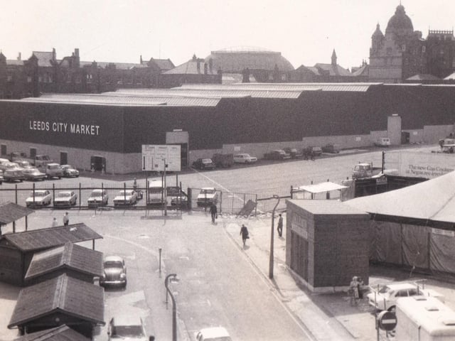 Outside the newly developed Kirkgate Market in August 1976. The 'Market Progress Report Board' can be seen in the centre of the photo.