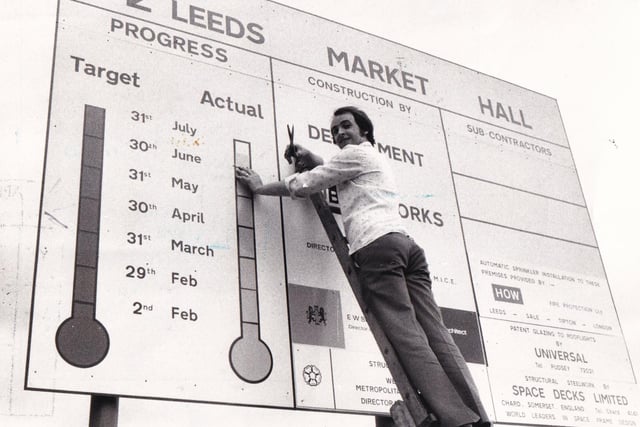 Billy Hamshaw who was working on the new market hall completes the finishing date of the 'Market Progress Report Board' in July 1976.