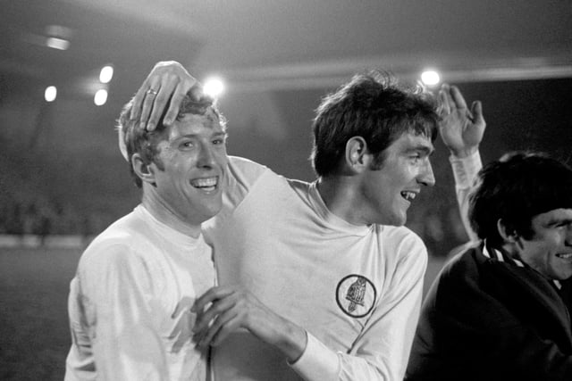 Mick Jones and Norman Hunter (right) celebrate after wrapping up the First Division title at Anfield.