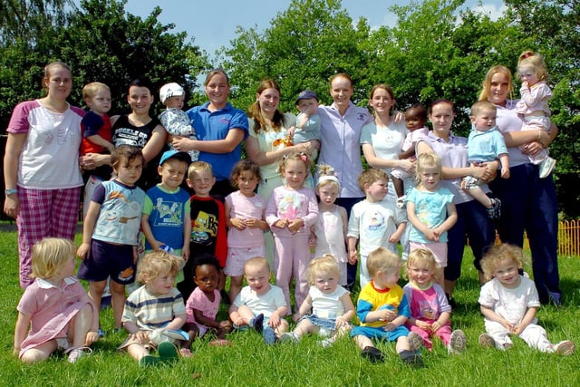Staff and todddlers from Little Achievers Day Nursery during their toddle in pyjamas around Brookfield Park