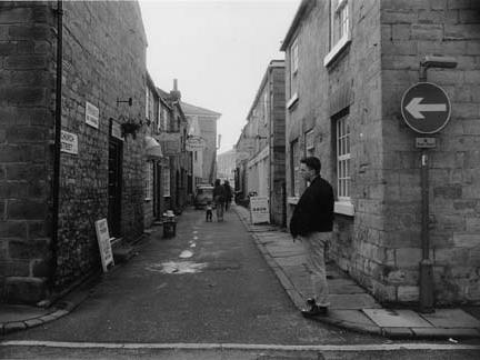 Church Street looking towards Market Place from junction with Bank Street. Write Stationery is on left, followed by Repro Pine and Mitchell Hill Gallery. Shops on right side include Stride and Stroll Clothing and the Basket Shop.