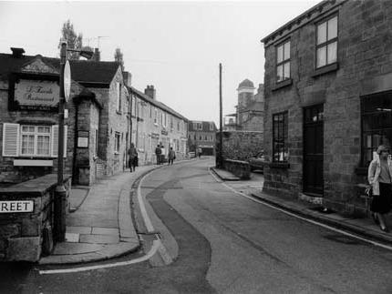 View looking south-east along Bank Street from the junction with Church Street. L'Escale Restaurant is on the left. The view looks towards North Street in the distance.