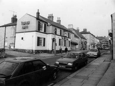 High Street showing the Red Lion public house in the centre. Further along is another public house, The Crown.