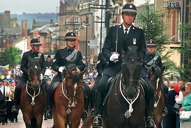 The West Yorkshire police Mounted Section lead the parade along Briggate.