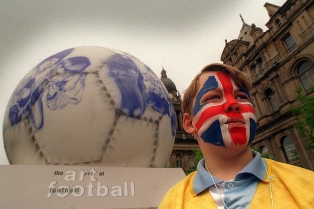 Phillip Souter, with a giant 12ft football, the culmination of a Leeds Council Arts project The Art of Football for Euro 96 on show in Victoria Gardens.
