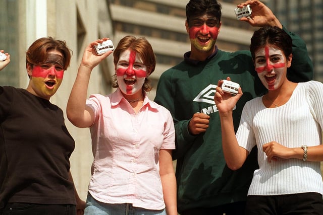 Leeds College of Technology students Kerry Phillips, Louise Farquhar, Tahir Jabar and Azadeh Nejah celebrate after BT Mobile donated them Euro 96 pagers, so they can keep in touch with the progress of the Three Lions during exams.