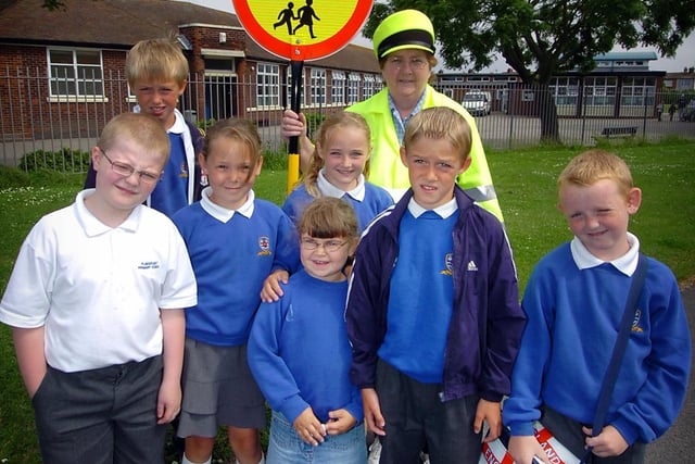 After a six-month long campaign pupils at Flakefleet School in Fleetwood have a crossing patrol. Lollipop lady Avril Bairstow with some of the pupils