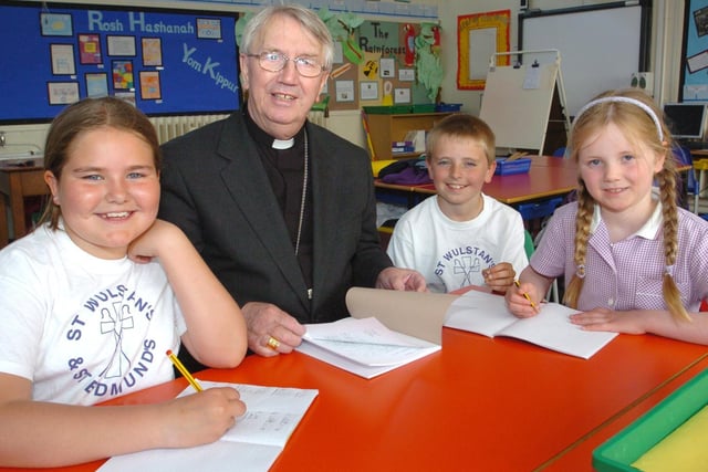 The Bishop of Lancaster Patrick ODonoghue visits children at St Wulstans and St Edmunds School in Fleetwood. Pictured left to right are pupils Katie Coward, nine, Oliver Rowe, nine and Danielle Huddleston, seven