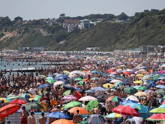 Crowds gather on the beach in Bournemouth as Thursday could be the UK's hottest day of the year with scorching temperatures forecast to rise even further.
