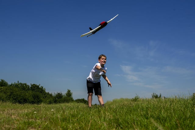 Riley Fisher, eight, from Ravensthorpe near Dewbury flyimng his glider as the heatwave continues across the county