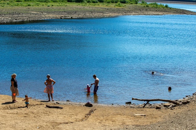 Families enjoying the hottest day of the year on the shores of Swinsty Reservoir
