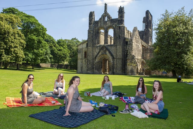 Students enjoy the sunshine in the grounds of Kirkstall Abbey as the heatwave continues across the county