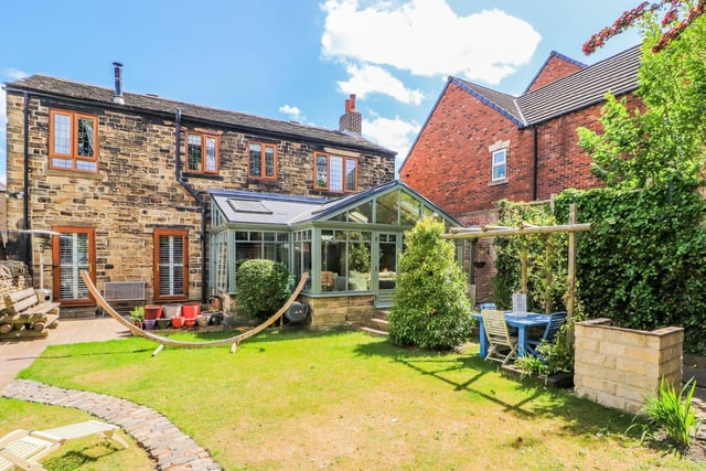 The enclosed garden to the rear is ideal for entertaining with an Indian stone paved patio, lawn, water feature, summer house and timber framed outbuilding which may be suitable for a variety of purposes such as home office or gym.