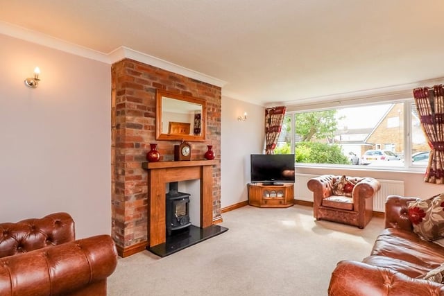 The living room on the ground floor has a feature fireplace and log burner. Also to the ground floor is a  dining room, kitchen and bedroom four.