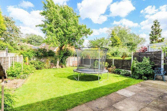 There is a lawned garden to the front of the property with a driveway to the side leading to a detached single garage. The enclosed garden to the rear incorporates a lawn, paved patio and garden shed with wood store.