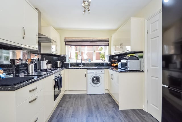 The kitchen is fitted to an excellent standard with a modern range of units and integrated appliances. It comprises of a range of modern cream fronted wall and base units with contrasting dark laminate worktops.