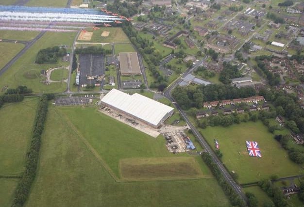 Flying over RAF Leeming as personnel are on the ground with a Union flag. Photo: Crown Copyright 2020.