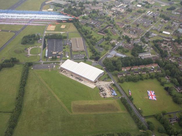 Flying over RAF Leeming as personnel are on the ground with a Union flag. Photo: Crown Copyright 2020.