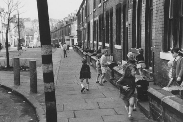 Children playing in Burley Lodge Road in October 1970.