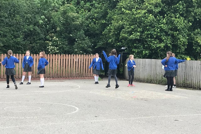 The early years and year six pupils are now back in class, catching up with 
 their lessons, and their pals...  while maintaining the social distancing rules