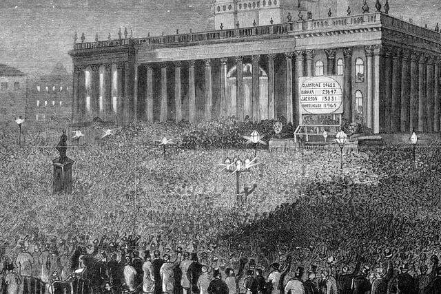 An engraving showing crowds gathered outside the Town Hall to hear the results of the General Election.